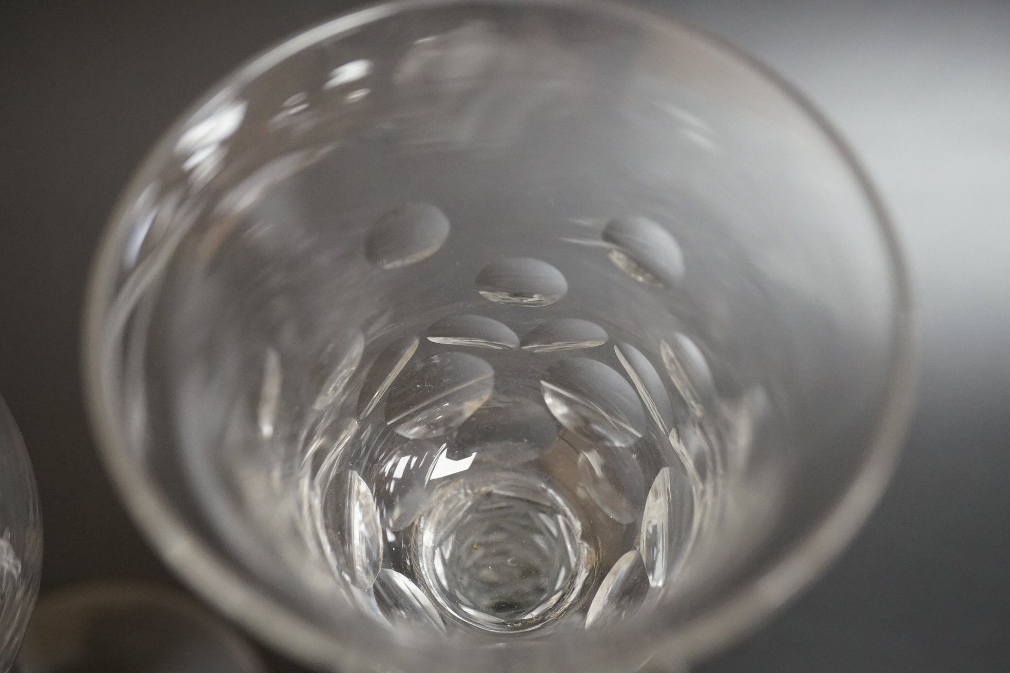 Two faceted wine glasses, c.1775, one with faceted star cut foot, tallest 15cm